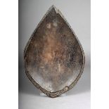 A Fiji priest's oil dish, of shallow leaf shape with a carved diaper border, the underside with adze