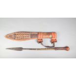A Touareg hand spear, with a leaf blade and copper and brass bands, pierced brass mount and