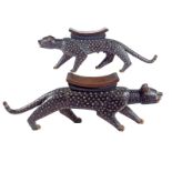 A pair of Baule Royal leopard stools, Ivory Coast, male and female, each with inset nutshell and