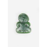 A Maori nephrite hei-tiki pendant, with incised linear decoration, pierced attachment aperture, 5.