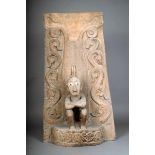 A Leti panel, Indonesia, with a relief carved tendril back and a seated male figure, with inlaid