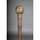 A Zulu knobkerrie, South Africa, wood with a spherical head and with banded copper and brass wire