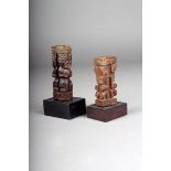 Two Marquesas Islands carved wood fan handles; one with two kneeling figures and a pierced centre,