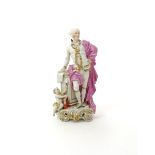 A large Derby figure of John Wilkes  c.1765-70, standing and resting one hand on a square plinth,