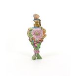 A Derby scent bottle  c.1765, formed as a posy of flowers tied around the stems with a pink