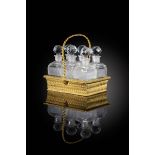 A Restauration ormolu scent bottle holder, in the form of a basket with a spiral twist handle and