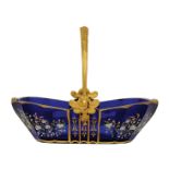 A rare Empire blue glass and ormolu basket, the swing handle cast with leaves and flowers above male