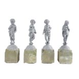 A set of four lead cherubs representing the four seasons, each on a stone pedestal, the figures: