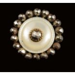 Three Louis XVI mother of pearl dress studs, two with cut steel mounts, the other inset a paste