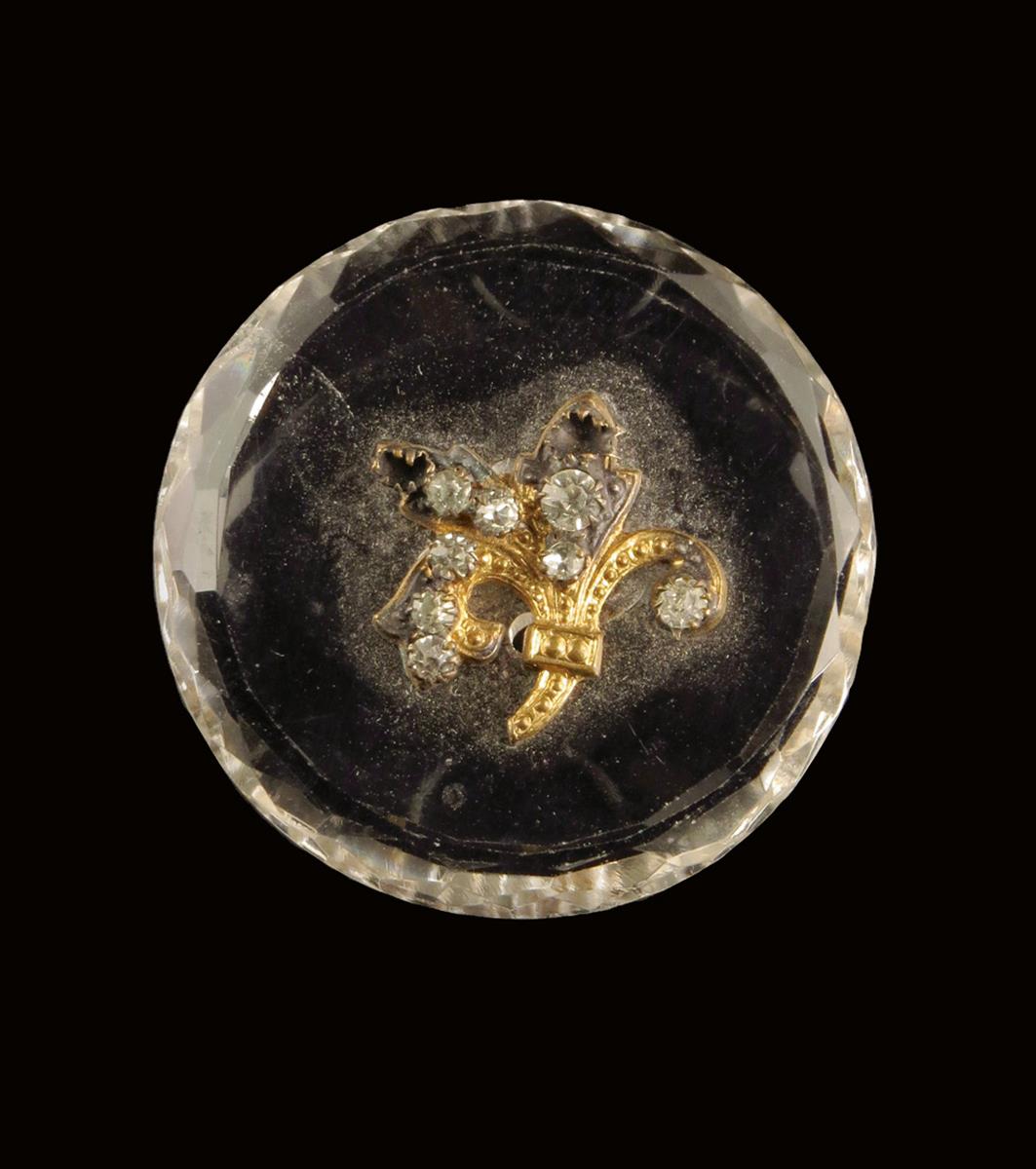 A set of four Napoleon III cut crystal glass buttons, decorated with a gilt metal and paste set