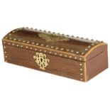 λ A 19th century French rosewood and brass mounted sewing box, the domed lid fitted with utensils