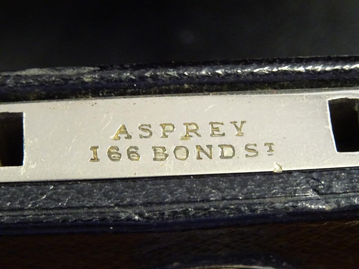 An early 20th century black leather writing box by Asprey, the hinged lid with a sunken brass handle - Image 13 of 13