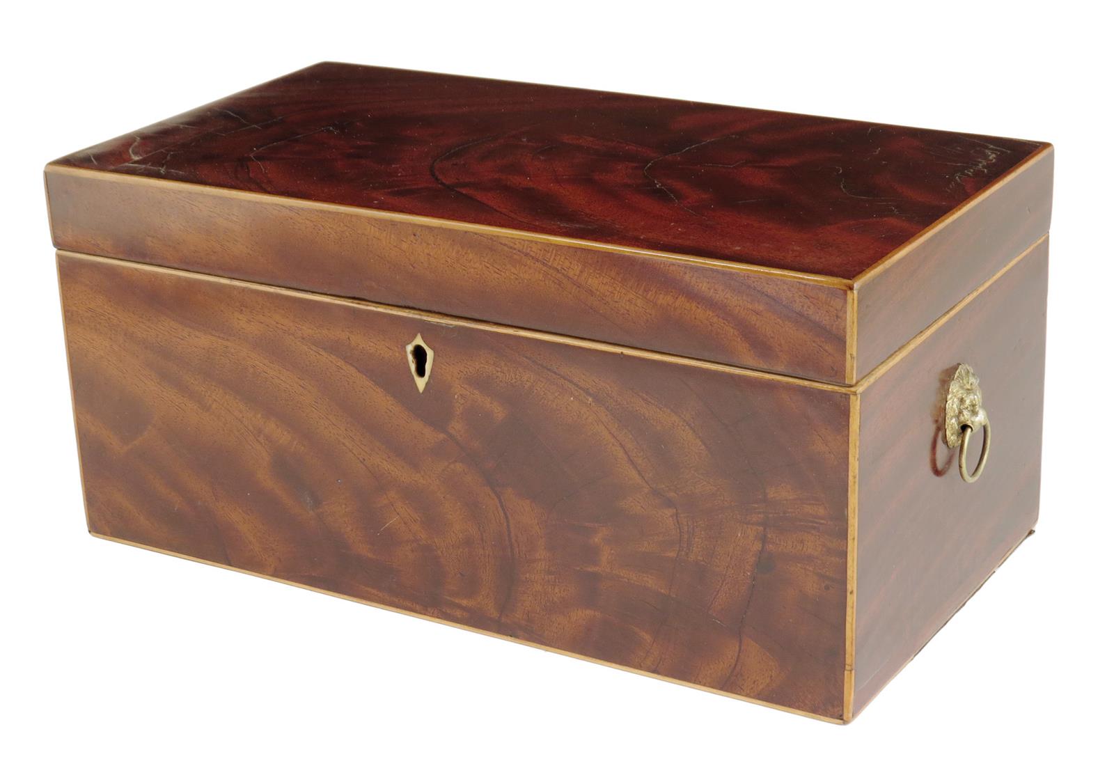 A late George III mahogany tea caddy, inlaid with boxwood stringing, the interior with five lidded