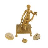 A 19th century ormolu Palais Royal ring holder, in the form of a young lady holding a swag of