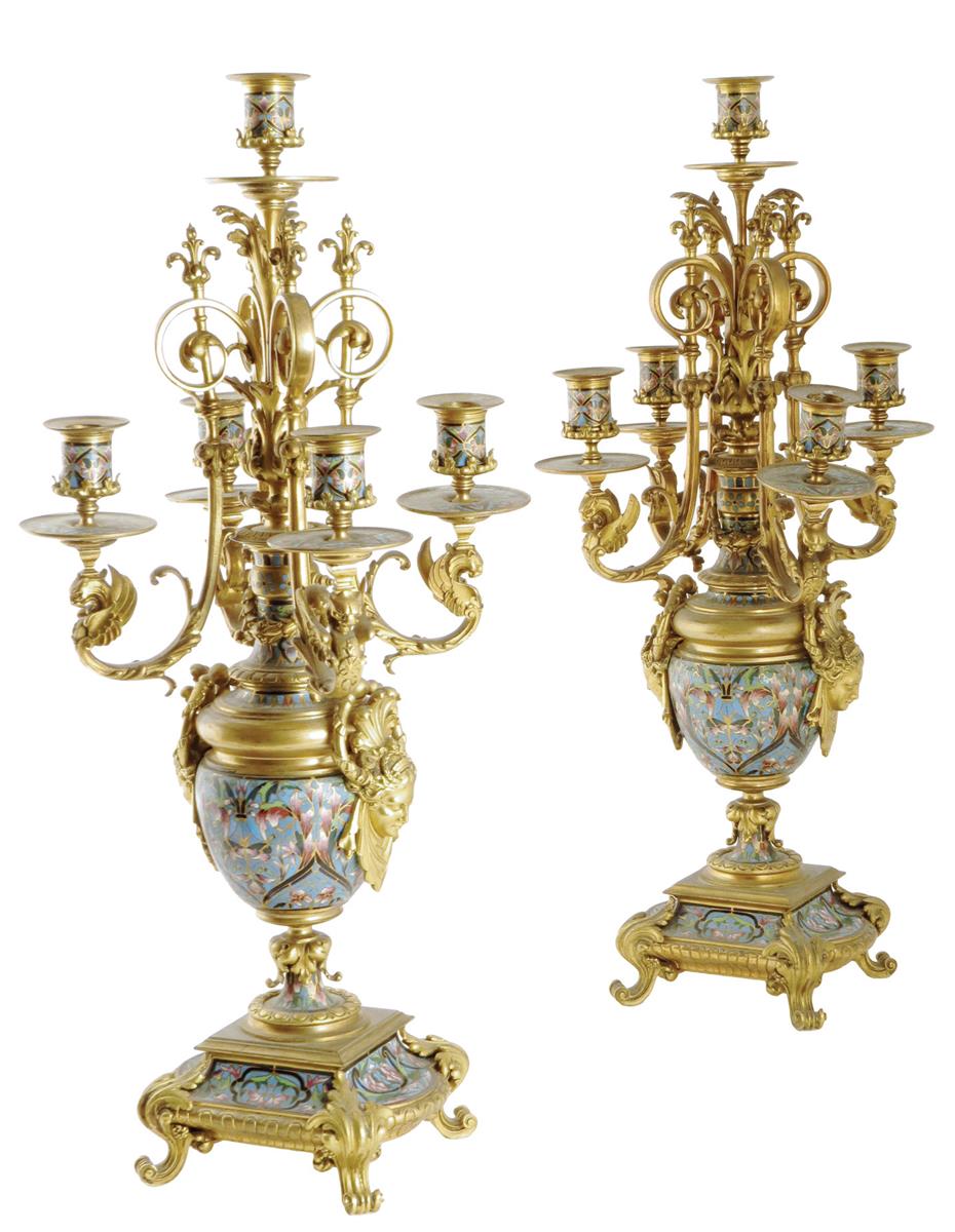 A pair of late 19th century French ormolu and champlevé enamel five light candelabra, decorated with