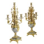 A pair of late 19th century French ormolu and champlevé enamel five light candelabra, decorated with