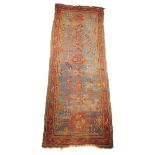 A Turkish Ushak long rug, west Anatolia, early 20th century, 343 x 127cm.