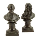 A pair of French bronze busts of Rousseau and Voltaire, each on a socle, early 19th century, 16.