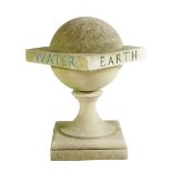 A carved stone ball finial, polychrome inscribed with 'EARTH, AIR, FIRE, WATER', on a socle and