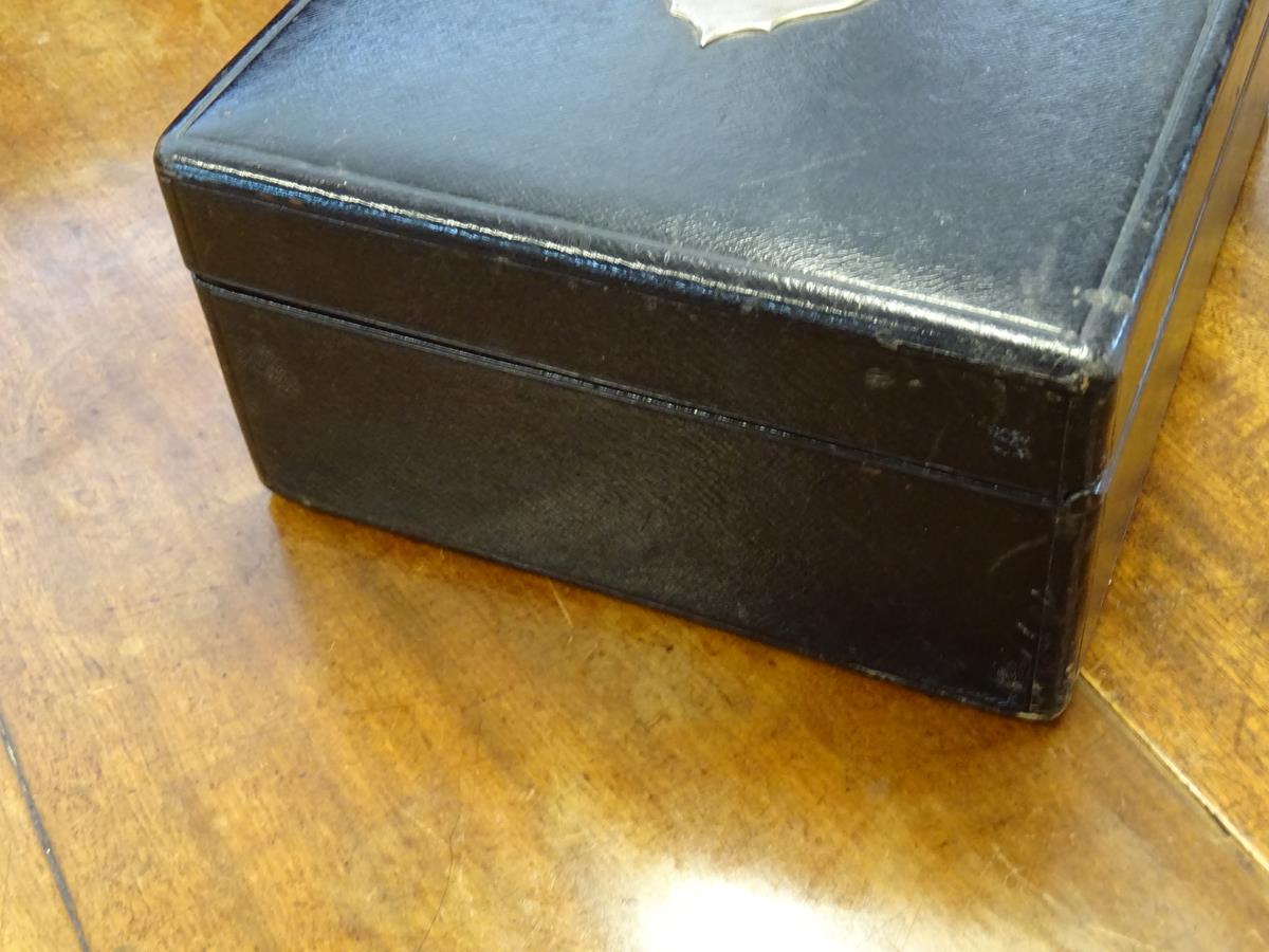 An early 20th century black leather writing box by Asprey, the hinged lid with a sunken brass handle - Image 5 of 13