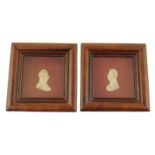 A pair of 19th century relief portrait busts of French officers, one in wax, each mounted in a