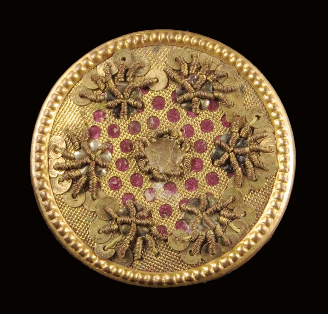 A set of ten Louis XV gilt metal and pink foil buttons, decorated with cannetille and applied