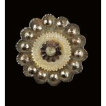 A set of five Louis XVI cut steel and mother of pearl buttons, in the form of a flowerhead, 4cm