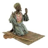 An Austrian cold painted bronze of an Arab praying in the manner of Bergman, kneeling on an oriental