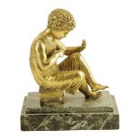 A 19th century gilt bronze figure of a seated cherub, on a stepped verde antico marble base, 19.