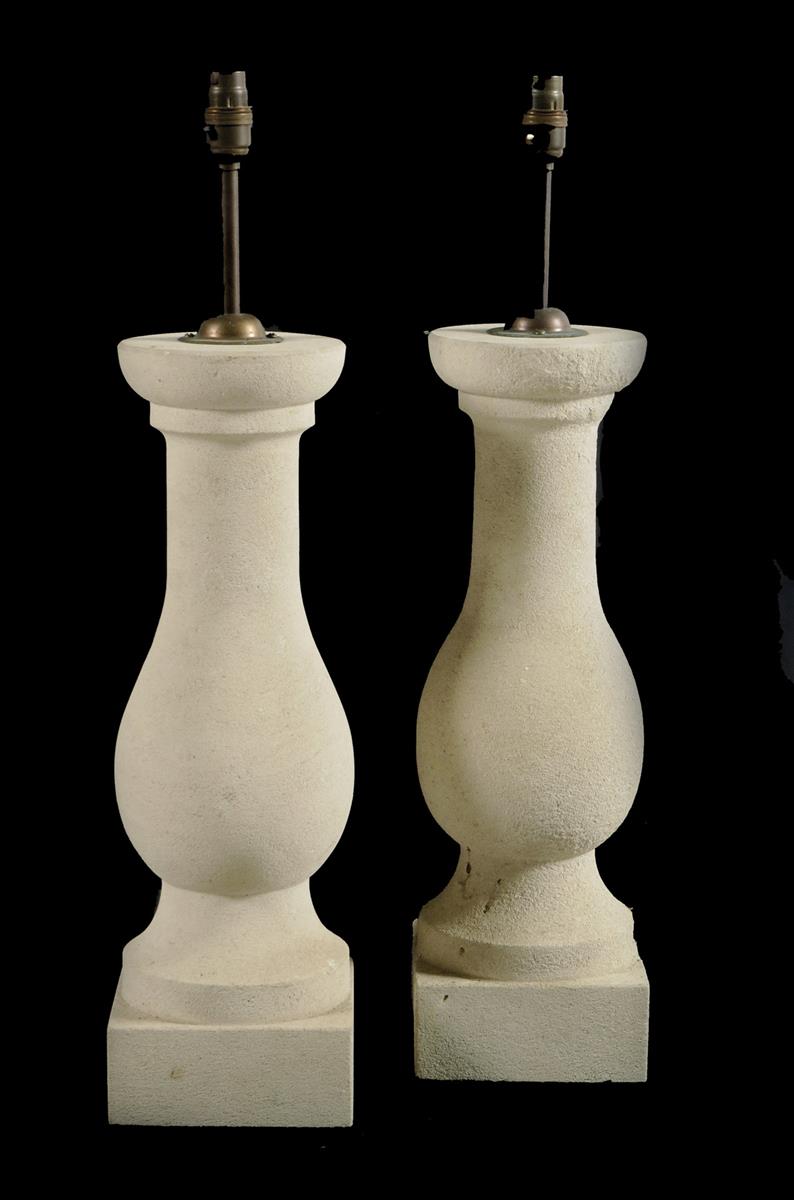 A pair of stone balustrade lamps, with brass fittings, 64.2cm high. (2)
