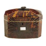 λ A Regency tortoiseshell tea caddy, inlaid with pewter stringing and with ivory edging, with a