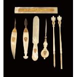 Seven early 19th century Palais Royal mother of pearl and gold utensils, each marked with an