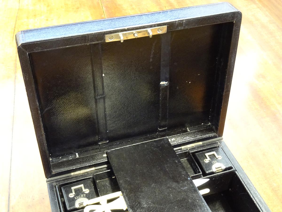 An early 20th century black leather writing box by Asprey, the hinged lid with a sunken brass handle - Image 11 of 13