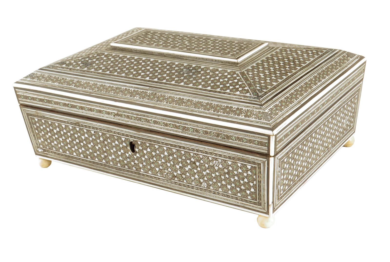 λ An Anglo-Indian sadeli and ivory work box, of sarcophagus shape, the interior with a mirror fitted