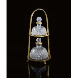 A Restauration ormolu scent bottle stand, in the form of a stirrup, the top with a buckle above