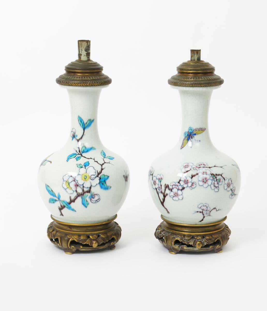 A pair of pottery lamp bases  probably by Theodore Deck, bottle form. painted with butterflies