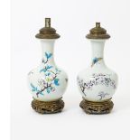 A pair of pottery lamp bases  probably by Theodore Deck, bottle form. painted with butterflies