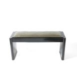 An ebonised wood piano stool,  double width, with hinged seat, the seat with faux shagreen covering,
