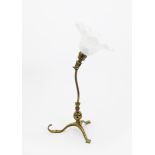 A W.A.S Benson brass table or wall light, on tripod foot,  with articulated stem, with opaque