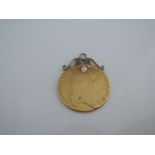 A George III Guinea coin, mounted to be a pendant, 8.7g
