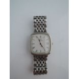 A lady's stainless steel wristwatch, Omega De Ville, the cushion-shaped white dial with black