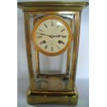 A 19th century French brass and four pane mantle clock, the drum movement by Leroy & Co, 13 & 15