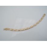 A 14ct gold bracelet, composed of stylised Aztec links, 13.3g
