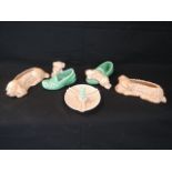 A collection of Sylvac novelty dog ornaments including a pair of posy vases with buff glaze in the