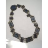 A white metal and lapis lazuli belt, 890mm in length