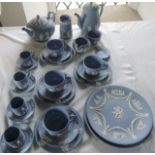 A quantity of Wedgwood blue ground Jasperwares comprising teapot, coffee/hot water pot, two jugs,