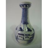 A 19th century Chinese blue and white vase with drawn neck and painted landscape decoration