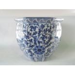 An oriental blue and white jardinière of octagonal form with stylised flower head and trailing