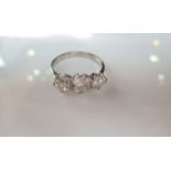 A three-stone diamond ring, set with three old European-cut diamonds weighing approximately 0.51cts,