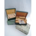 A green leather Rolex Oyster watch box, with suede lining, together with 2001/2002 calendar card,